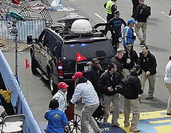 Seven apparent Craft International rent-a-soldiers behind and departing (top rt. with backpack) a communications van Seven apparent Craft International rent-a-soldiers behind and departing (top rt. with backpack) a communications van