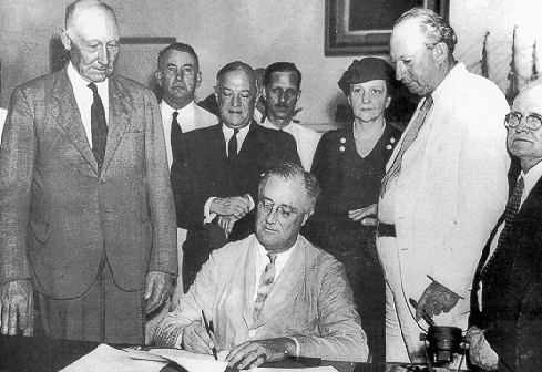 President Roosevelt signs the Social Security Act in 1935, providing retirement security for the next 77 years and beyond