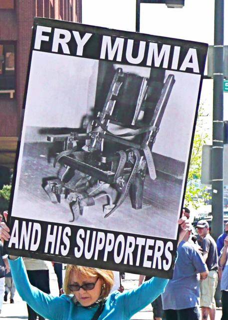 Public pressure to release Mumia Abu-Jamal from the "Hole" trumped the pressure from those trying to keep torturing him (photo b